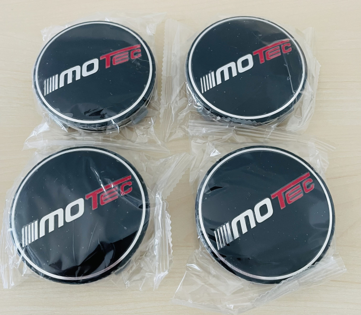 Motec Nabenkappe schwarz - altes Logo mit silbernem Rand